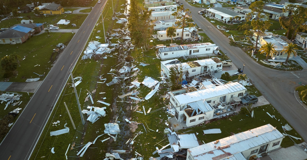 Badly damaged mobile homes after hurricane Ian in Florida residential area.